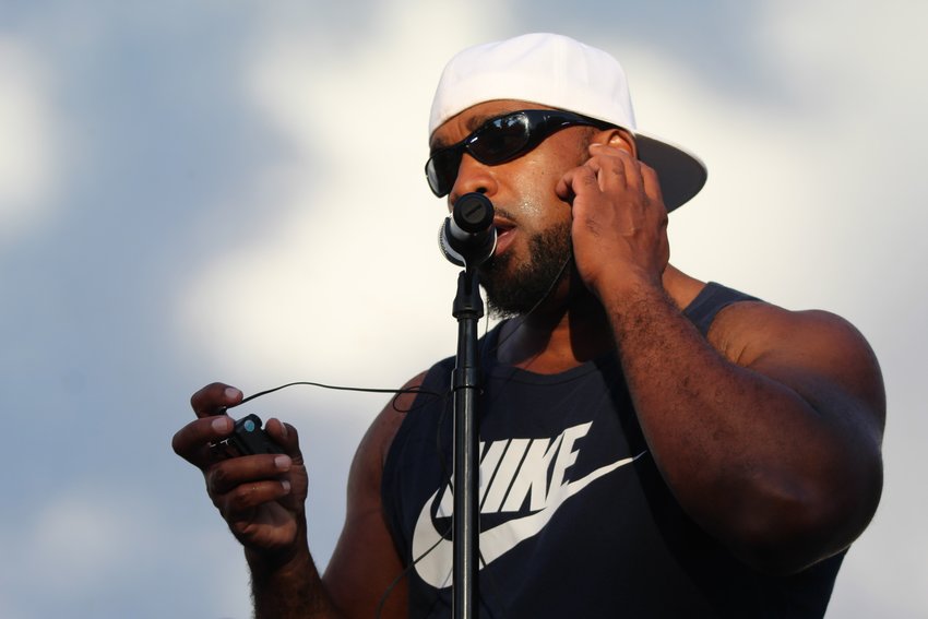 Julius "Bad Juju" Henderson, vocalist for Little Moses Jones, does a soundcheck before the Movies & Music in the Park event Aug. 12 at Parfet Park.